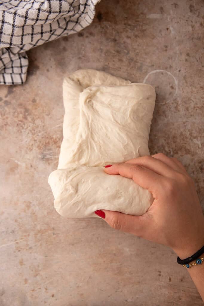 dough being rolled up