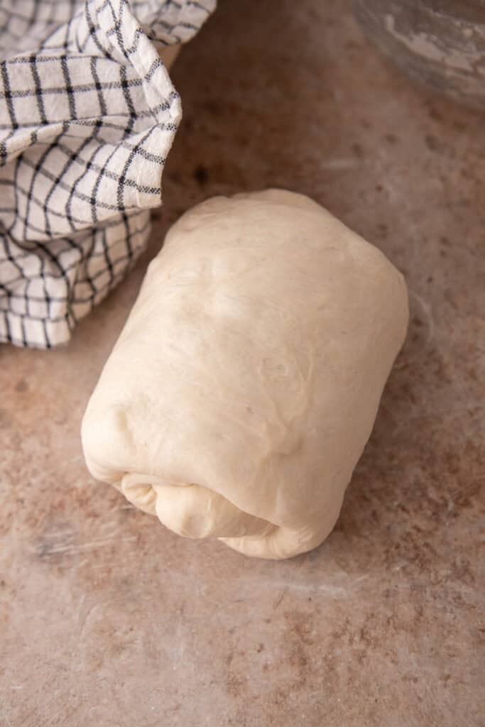 dough being rolled up