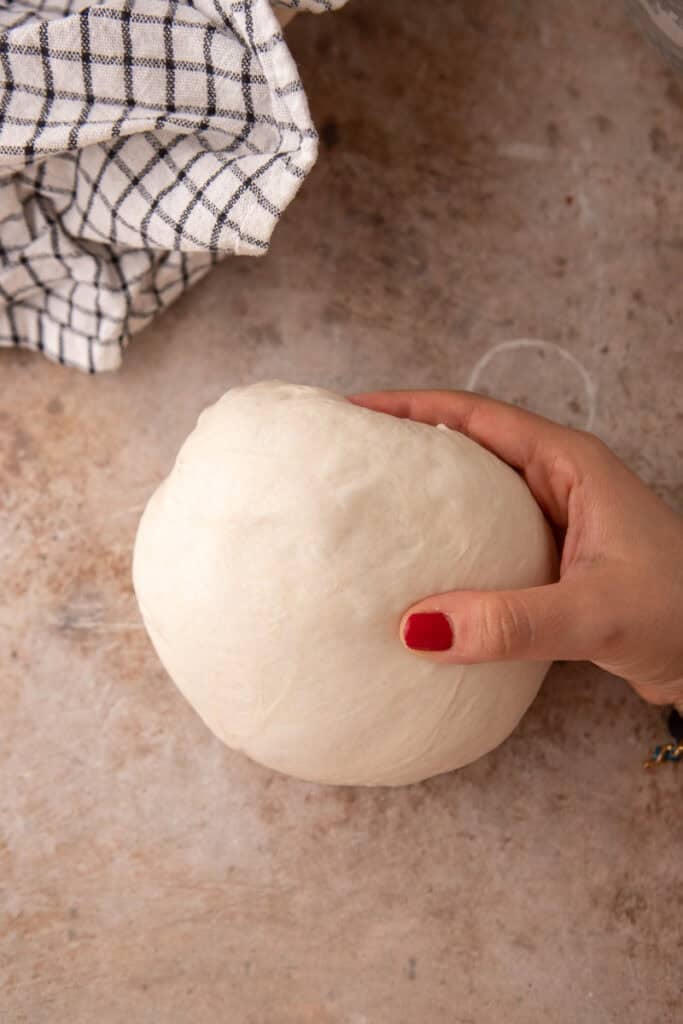 dough being rolled up