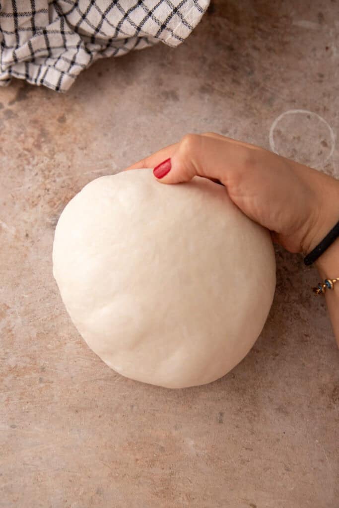 dough being rolled up