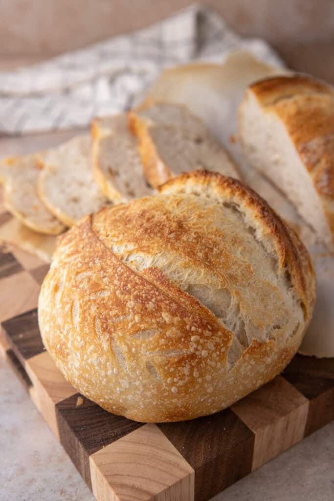 same day sourdough bread recipe on top of a cutting board