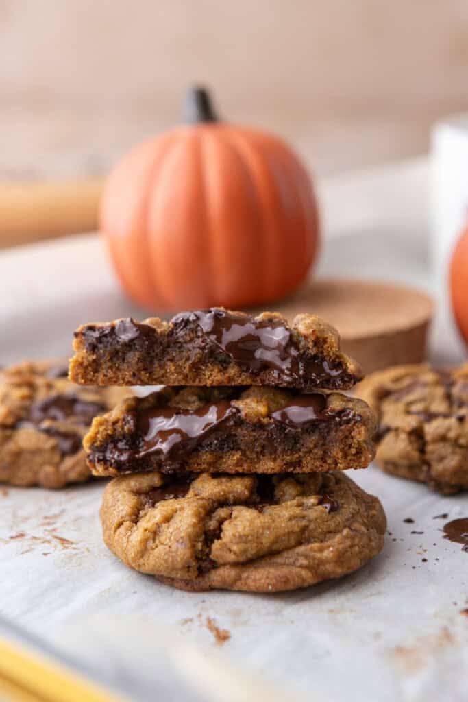 Brown Butter Pumpkin Chocolate Chip Cookies on parchment paper stacked