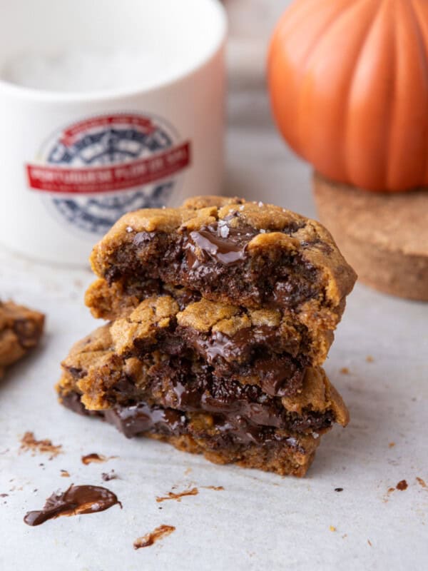 Brown Butter Pumpkin Chocolate Chip Cookies on parchment paper stacked