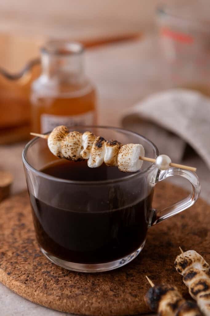 toasted marshmallows sitting on a coffee
