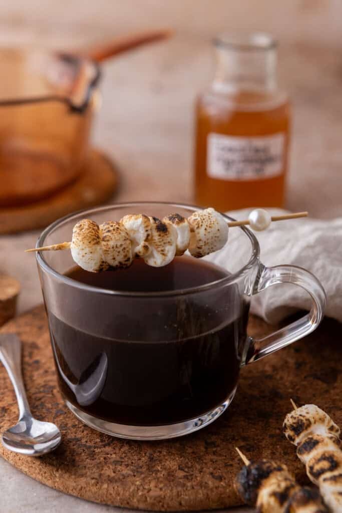 toasted marshmallows sitting on a coffee