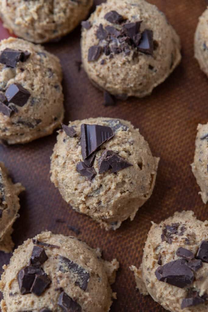 Scoops of cookie dough on a pan