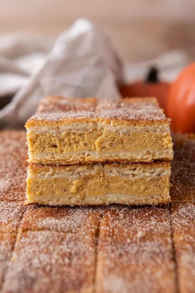 Churro Pumpkin cheesecake bars stacked up