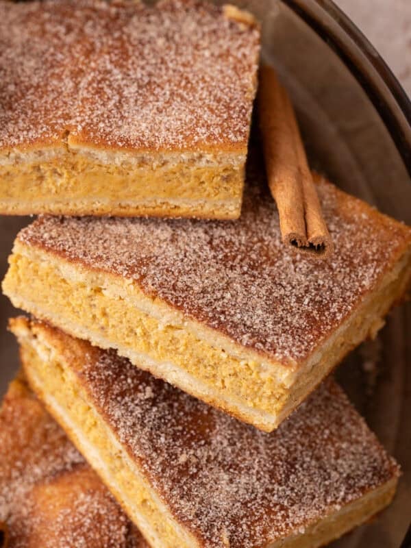 Churro Pumpkin cheesecake bars stacked up