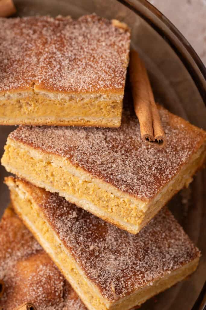 Churro Pumpkin cheesecake bars stacked up