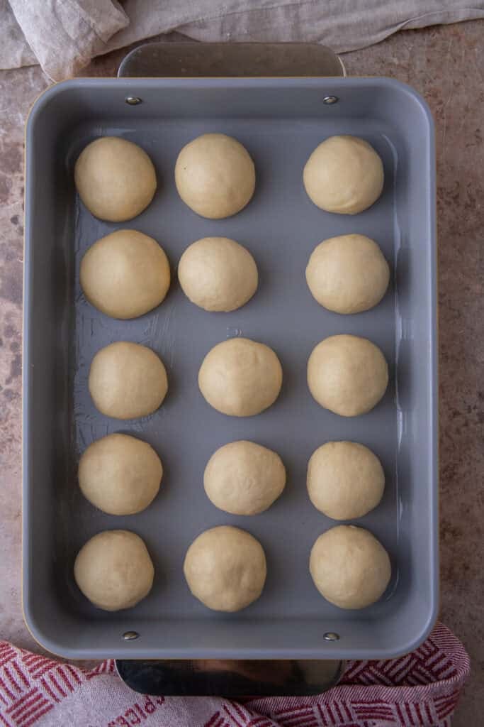 Bread buns before doubling in size