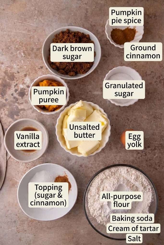 Labeled ingredients for brown butter pumpkin snickerdoodles including pumpkin puree, flour, sugars, spices and butter.