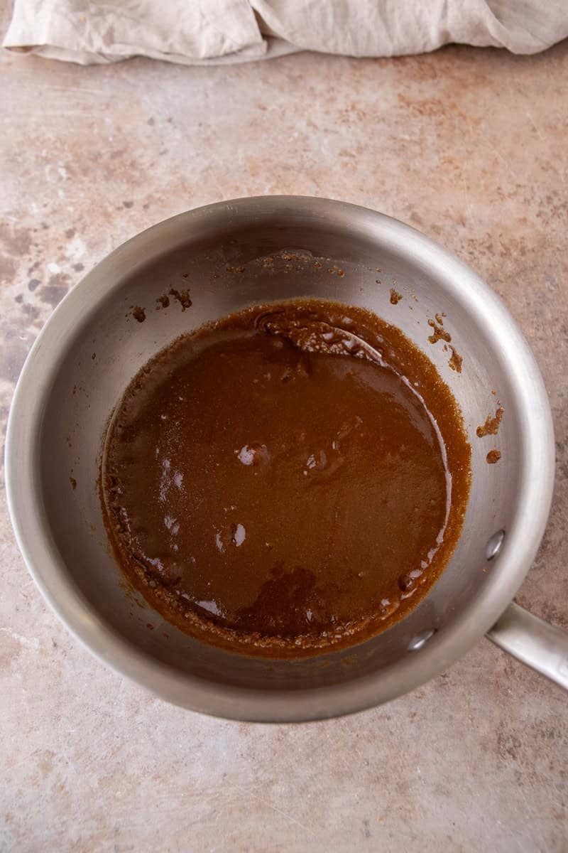Making butterscotch sauce in a saucepan, step 2.