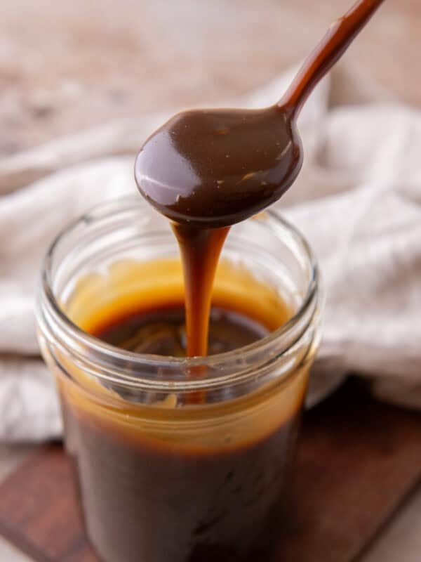 Butterscotch Sauce Recipe in a jar and a spoon