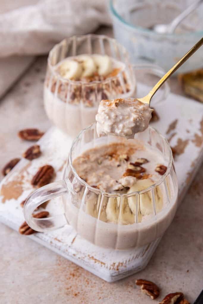 High Protein Overnight Oats recipe in a bowl being scooped with a spoon