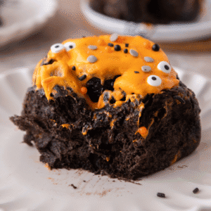 Halloween Black Cocoa Cinnamon Roll on a plate