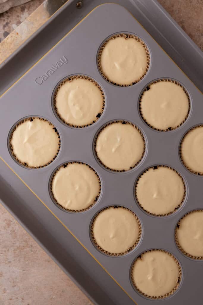 mixed filling ingredients in a muffin tin