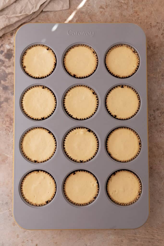 baked filling ingredients in a muffin tin