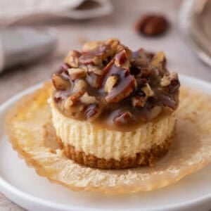 Mini Pecan Pie Cheesecakes on an opened muffin liner