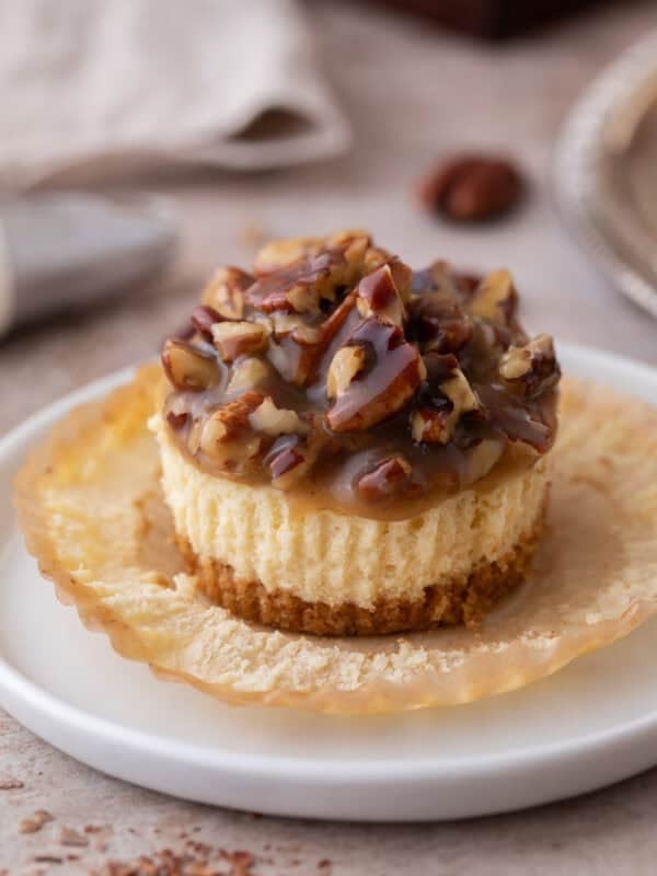 Mini Pecan Pie Cheesecakes on an opened muffin liner