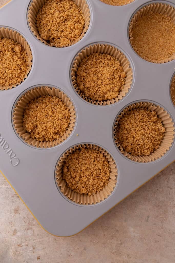 mixed crust ingredients in a muffin tin