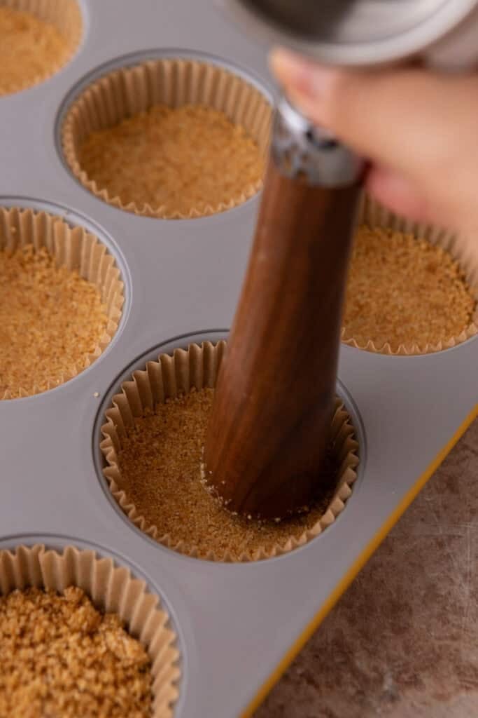 mixed crust ingredients in a muffin tin