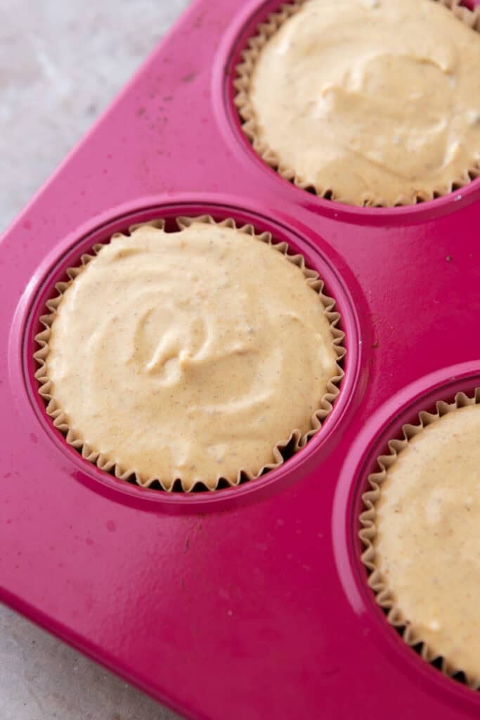 filling ingredients in the muffin liners