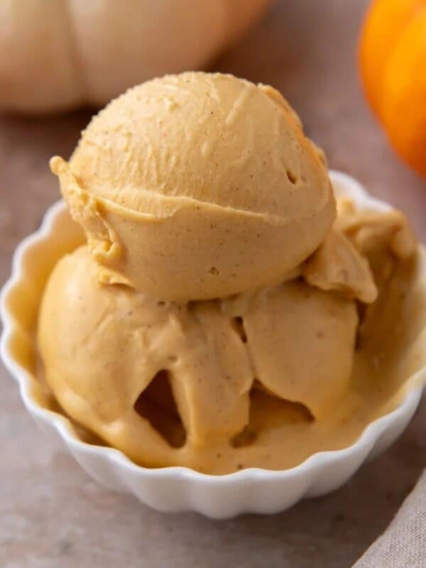 Scoops of high-protein Ninja Creami pumpkin ice cream in white bowl.