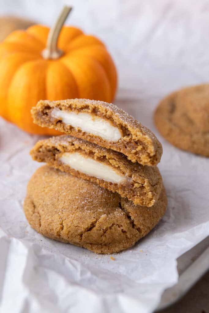Pumpkin Cheesecake Cookies stacked on each other