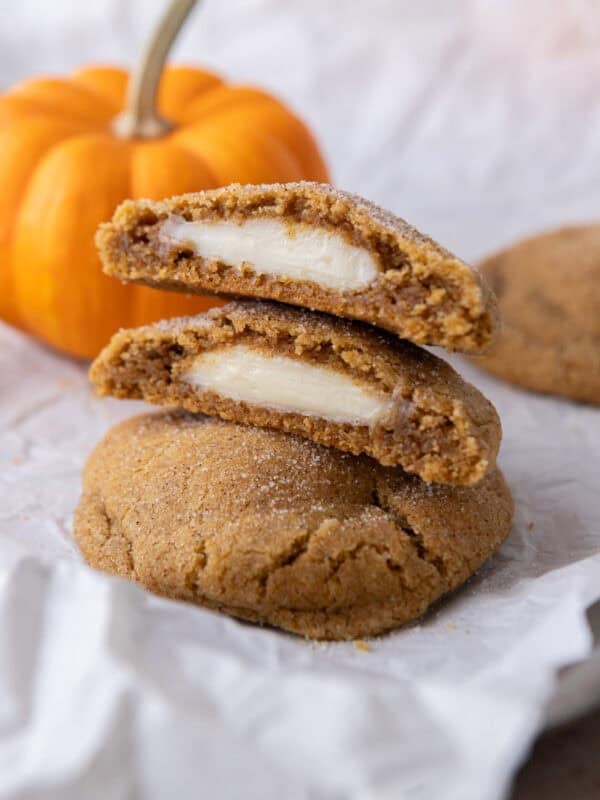 Pumpkin Cheesecake Cookies stacked on each other