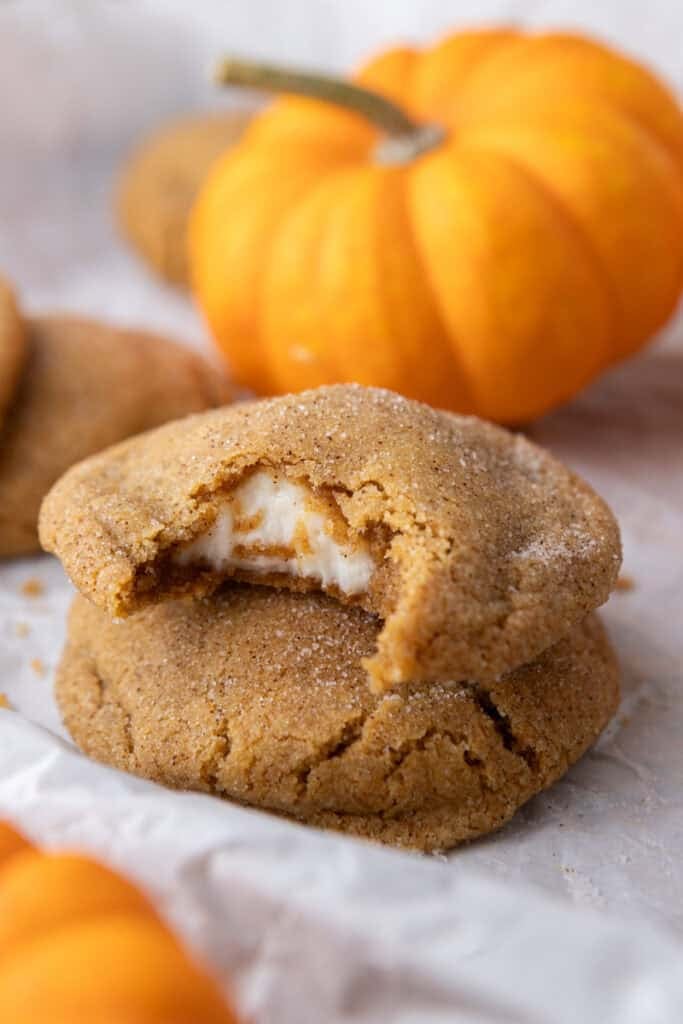 Pumpkin Cheesecake Cookies stacked on eachother