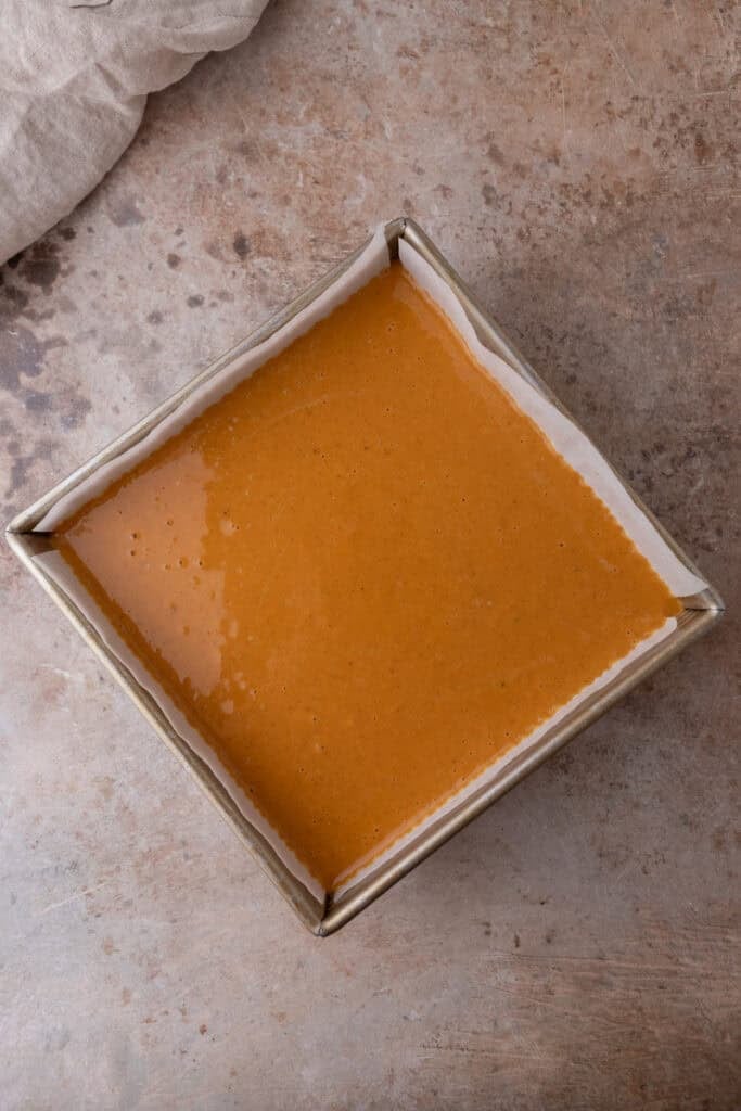 raw filling over baked crust in a pan