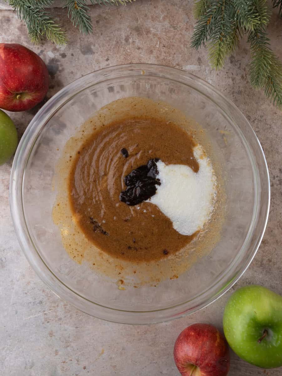 Apple butter and buttermilk added to wet ingredients for apple cider donuts.
