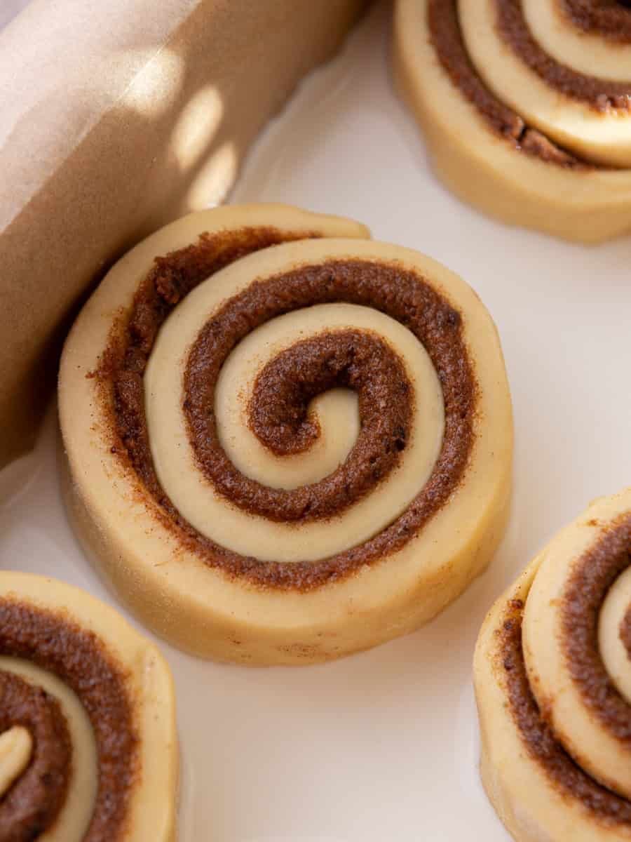 Unbaked cinnamon roll in pan before rising