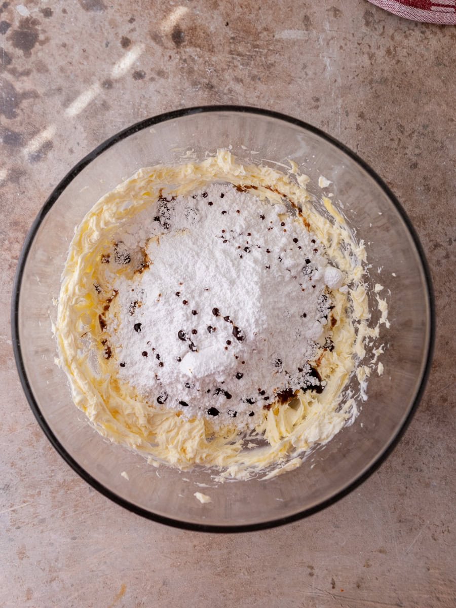  Butter and powdered sugar in bowl for cinnamon roll frosting