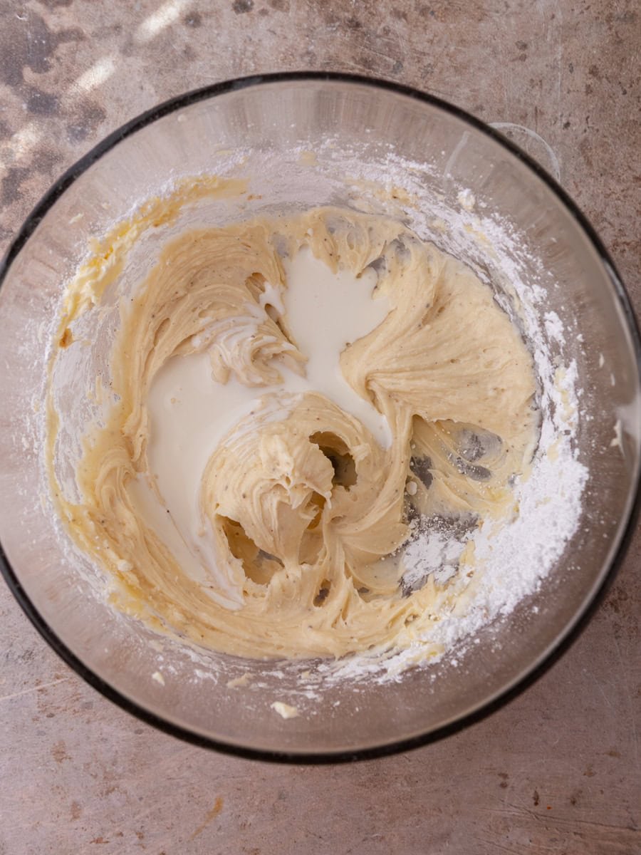 Cream cheese frosting being mixed to a smooth texture