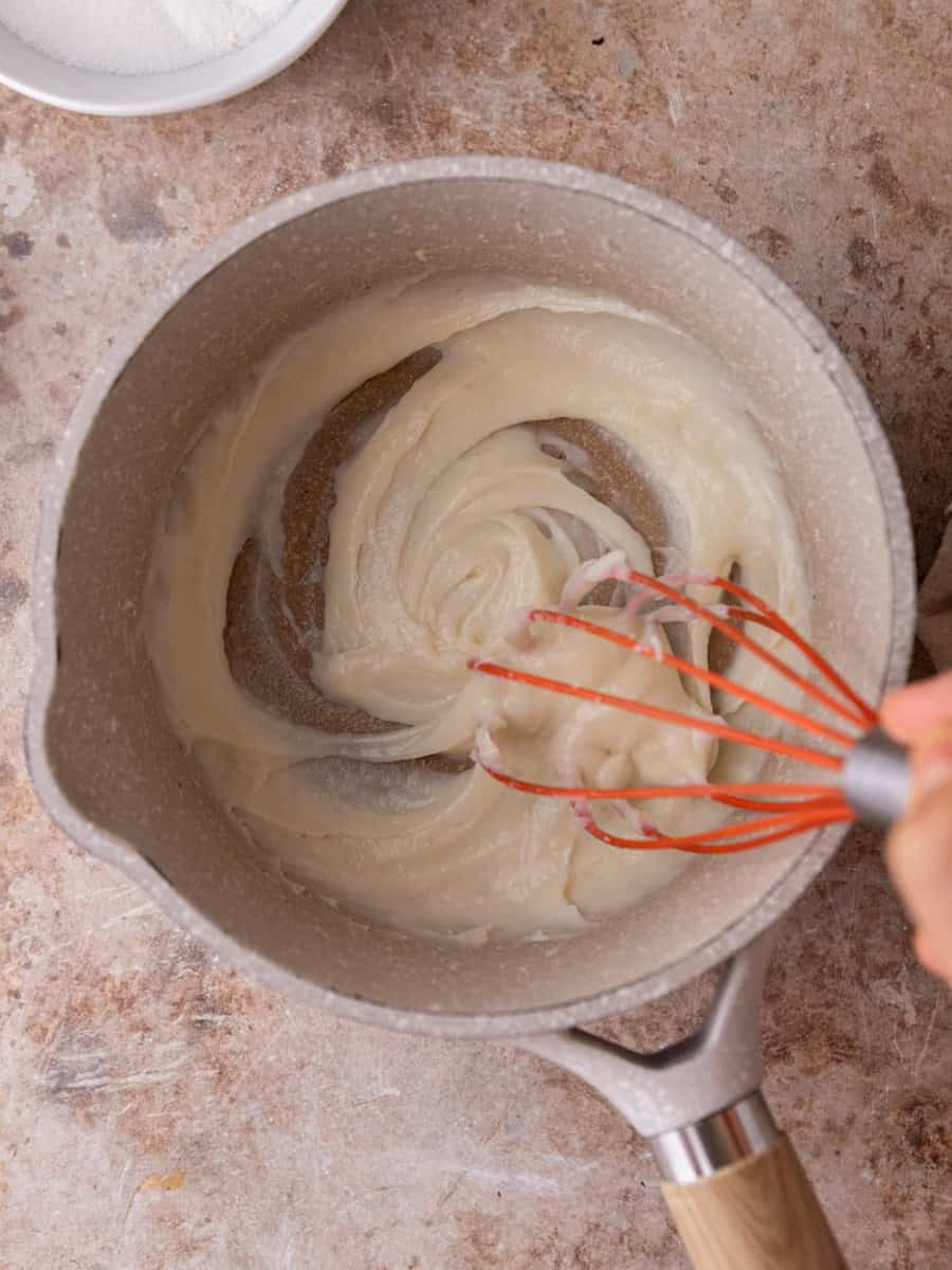 Thickened tangzhong paste in saucepan for cinnamon roll dough