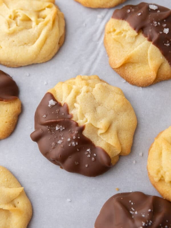Close up of butter cookies with half dipped in chocolate
