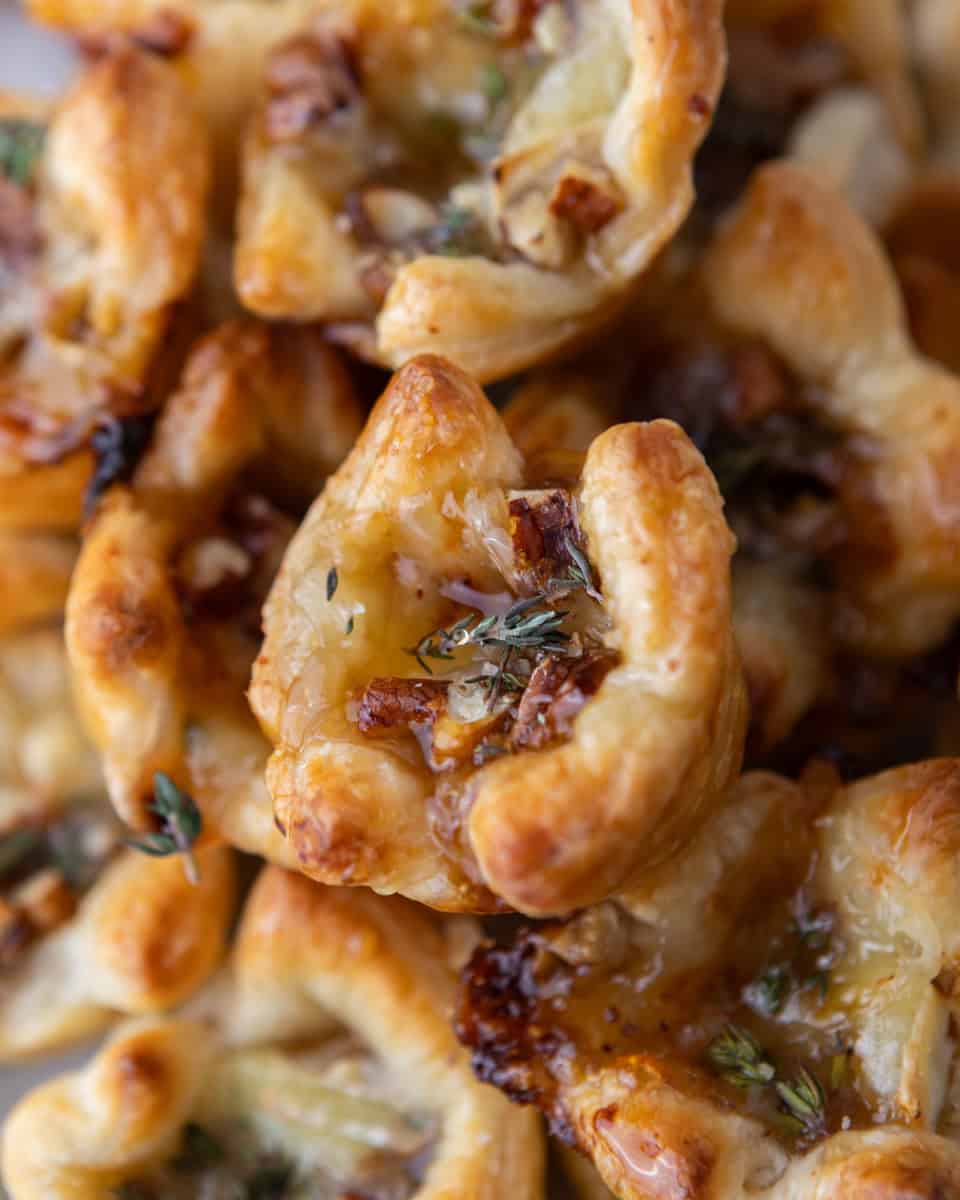 Close-up of flaky brie and fig jam puff pastry cup