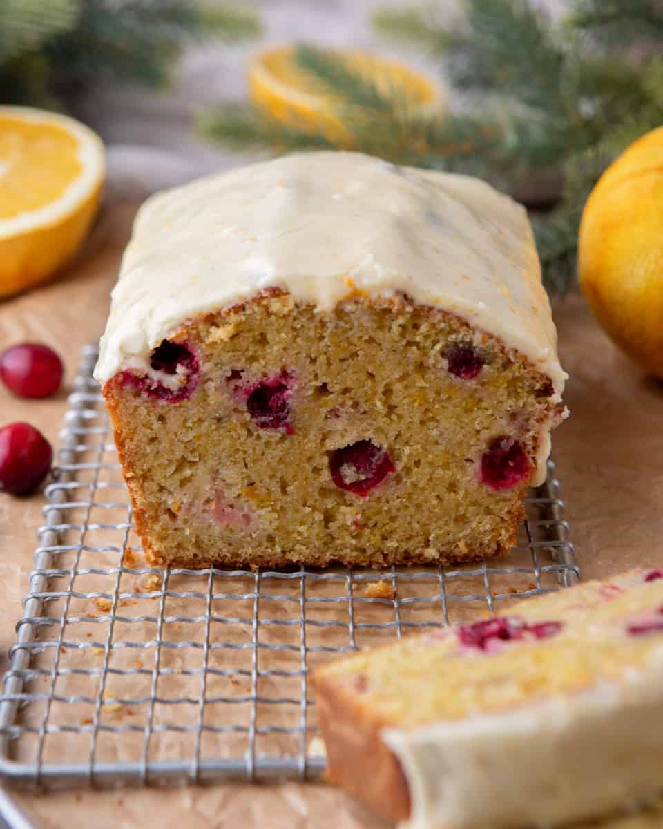 Whole cranberry orange bread loaf with orange glaze