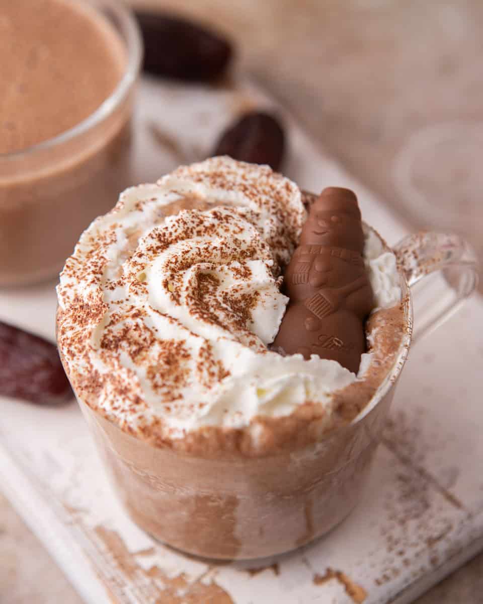 Close-up of date sweetened hot chocolate topped with whipped cream and chocolate
