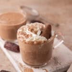 Creamy date sweetened hot chocolate served in a glass mug