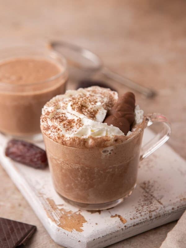 Creamy date sweetened hot chocolate served in a glass mug