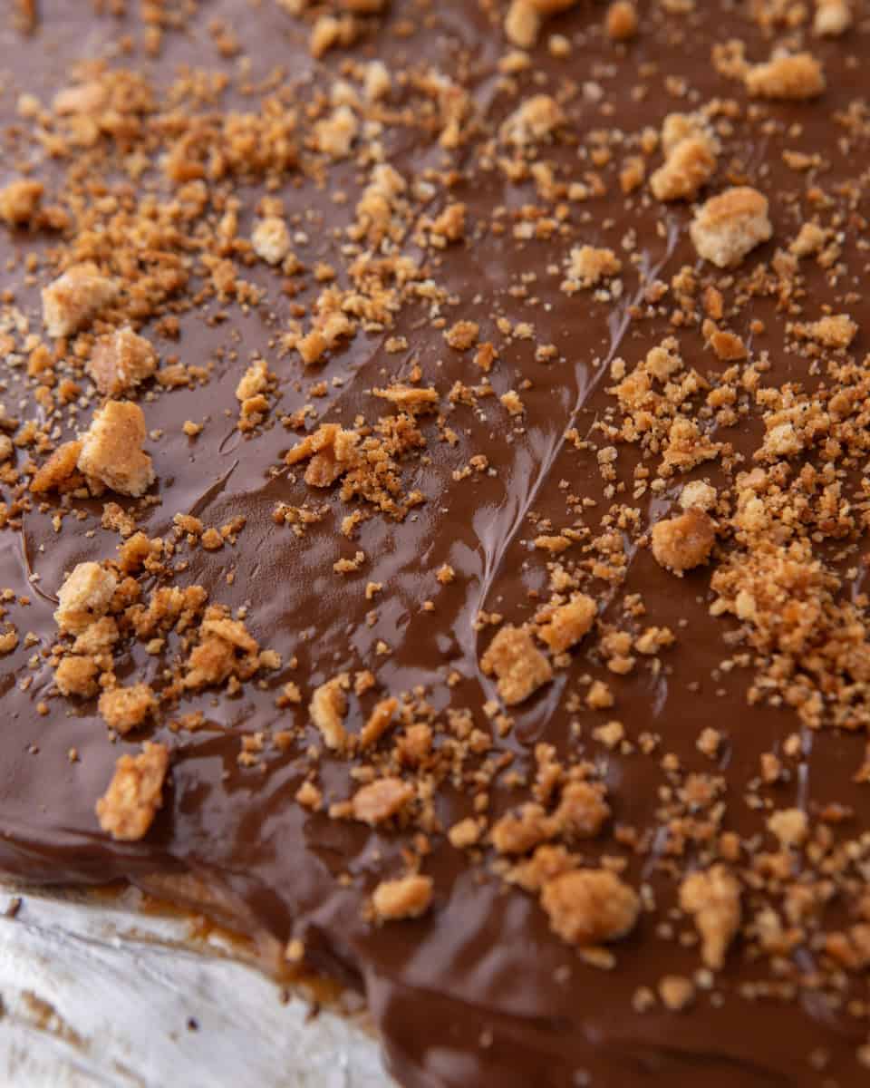 Melted chocolate spread over graham cracker toffee