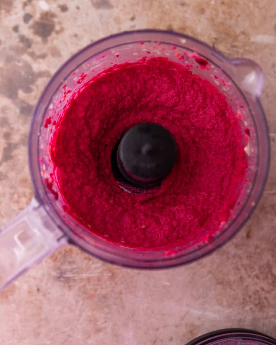 Creamy beet hummus blended in a food processor