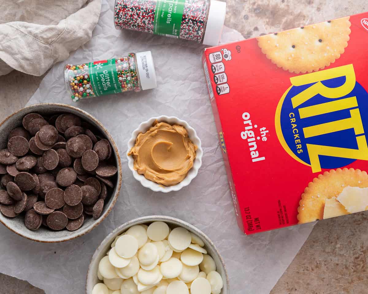Ingredients for Ritz peanut butter cookies including crackers, chocolate, and peanut butter