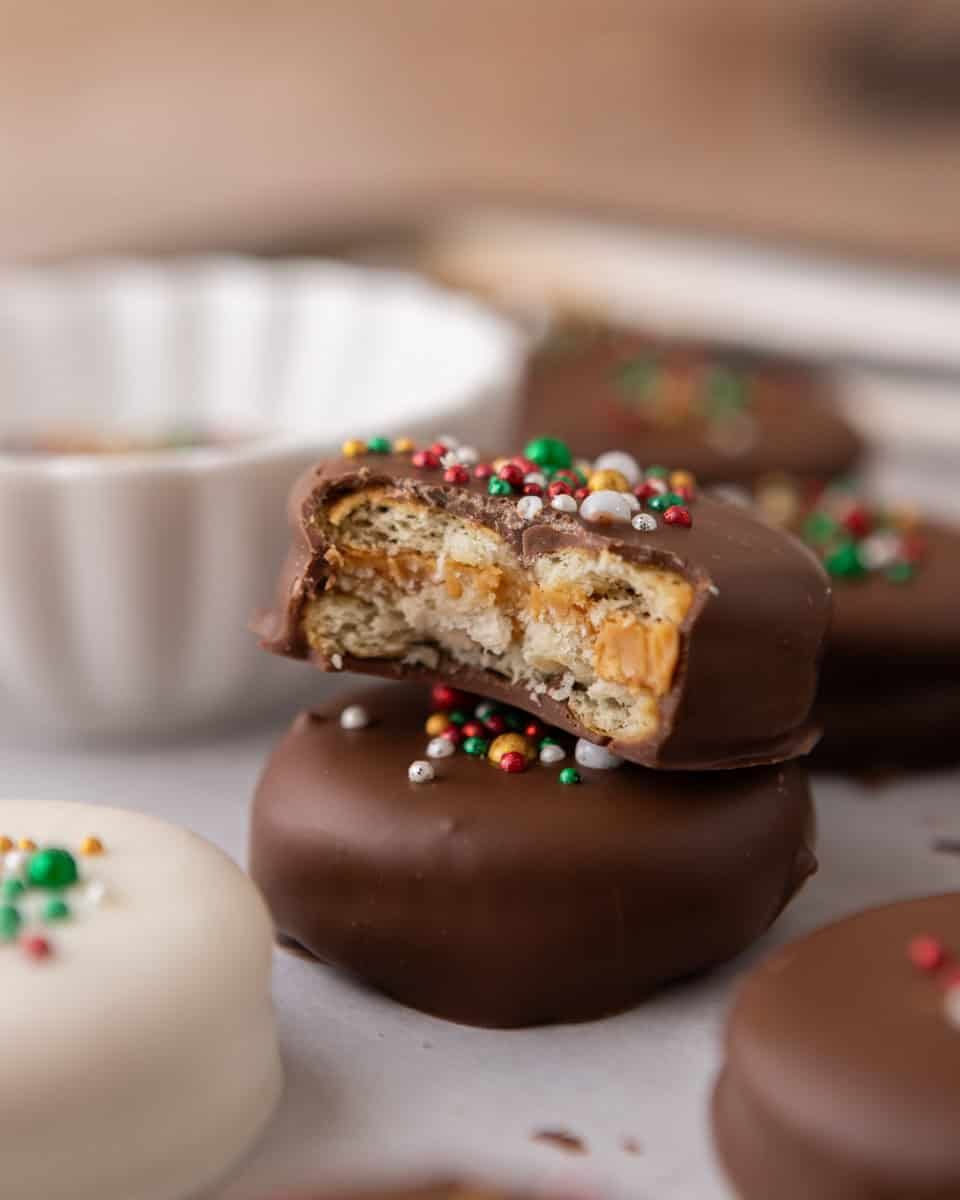 Stacked Ritz peanut butter cookies showing chocolate shell and peanut butter center
