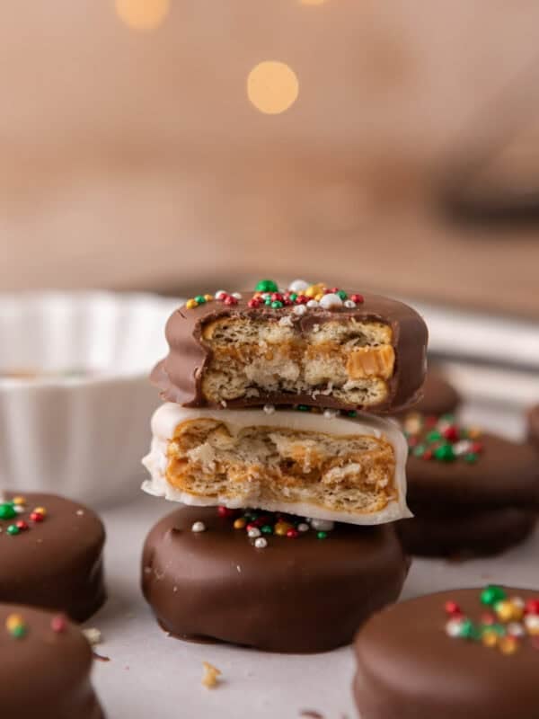 Ritz peanut butter cookies dipped in milk and white chocolate with festive sprinkles