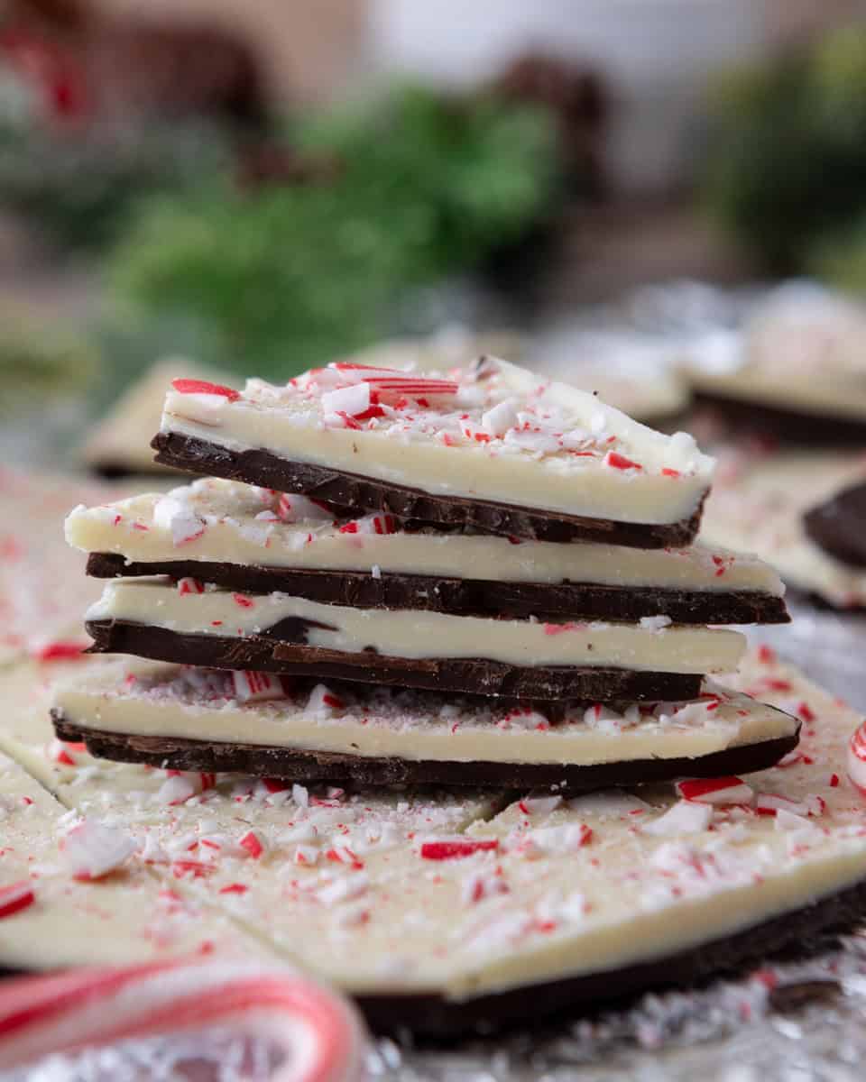 Close-up of classic peppermint bark stacked with candy cane pieces.