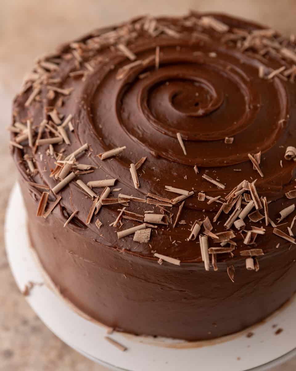 Chocolate beet cake frosted and decorated with chocolate shavings
