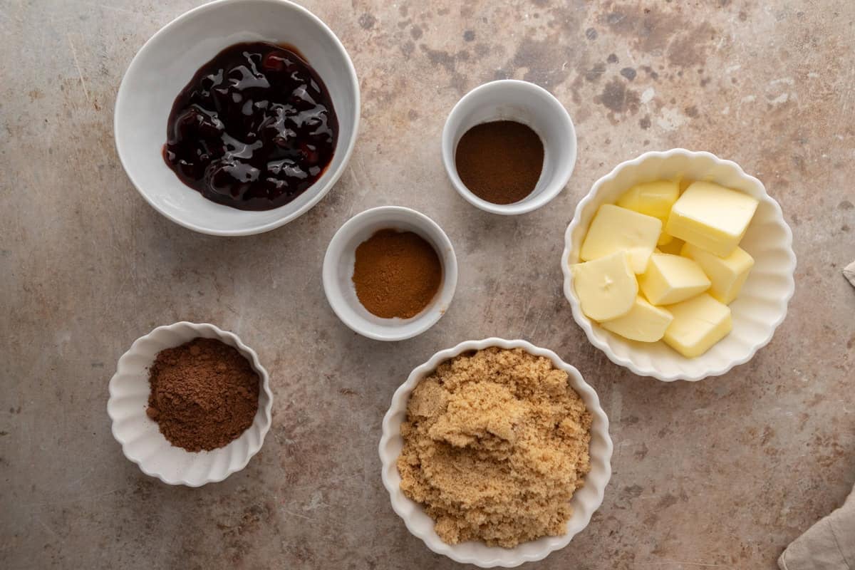 Cherry chocolate cinnamon roll filling ingredients with butter, brown sugar, cocoa, and cherries